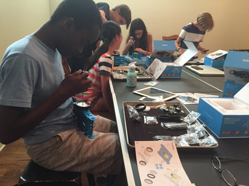students work on building robot